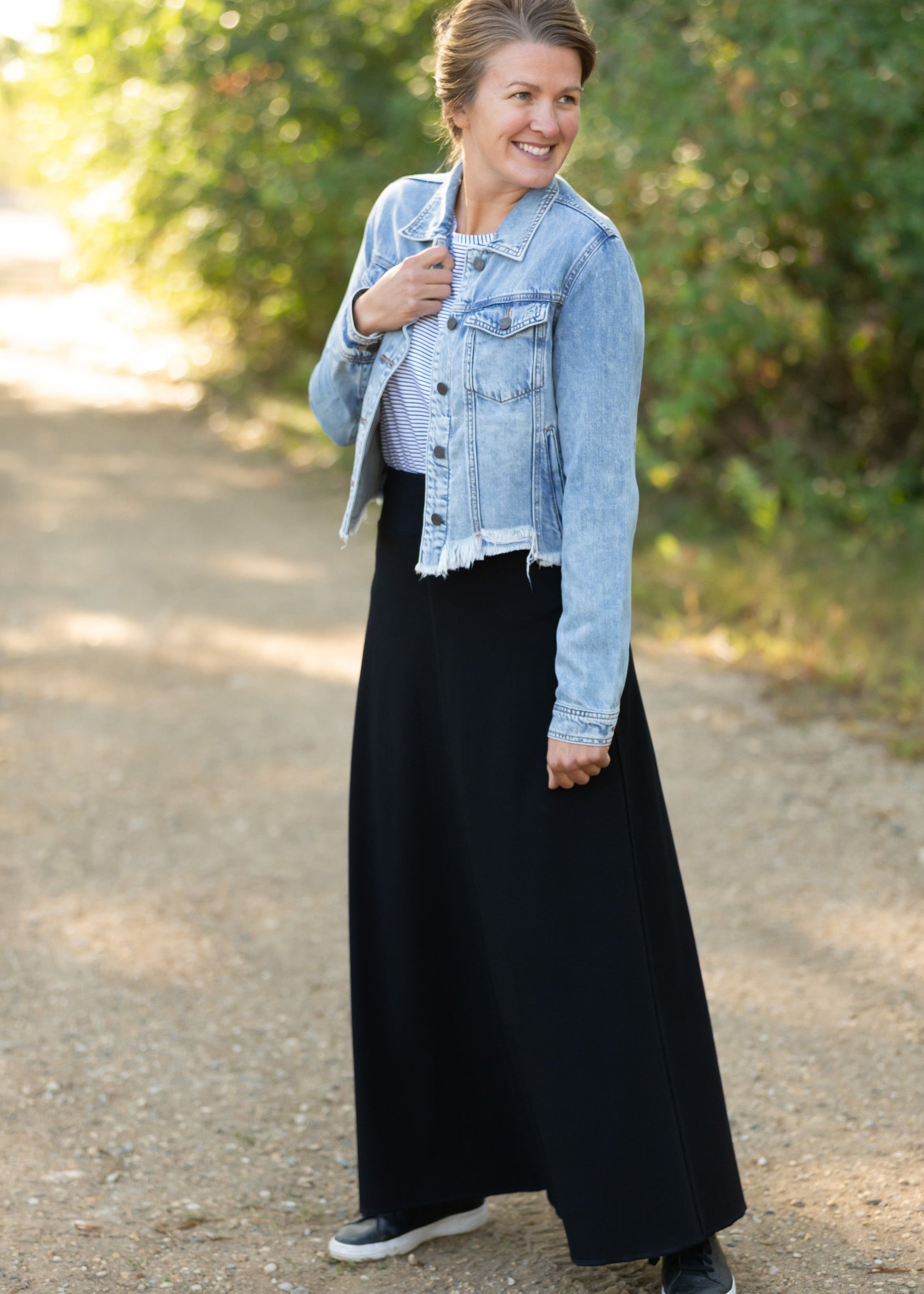 Frayed Light Wash Denim Jean Jacket with brass front buttons, a classic collar and a frayed hem.