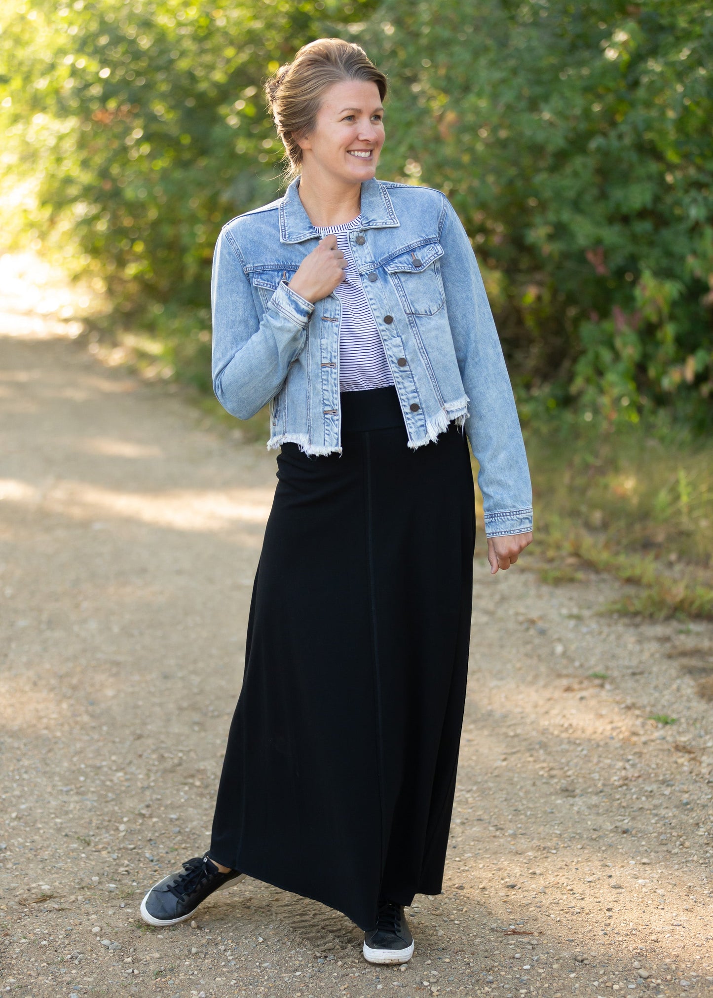 Frayed Light Wash Denim Jean Jacket with brass front buttons, a classic collar and a frayed hem.