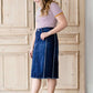 modest woman wearing a fringe dark denim below the knee skirt