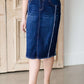 modest woman wearing a fringe dark denim below the knee skirt