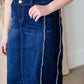 modest woman wearing a fringe dark denim below the knee skirt