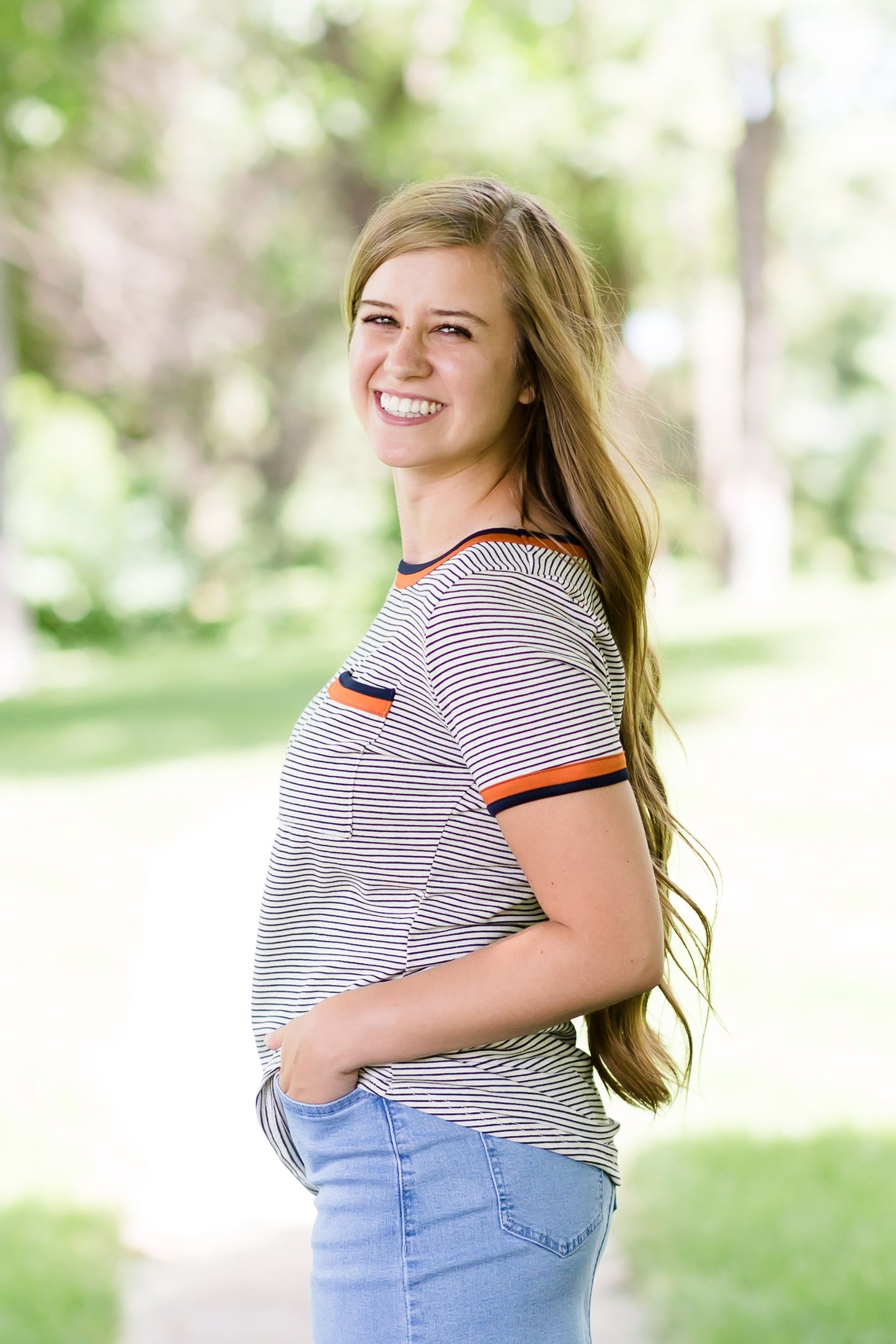 Navy striped tee with a rust accent and front pocket