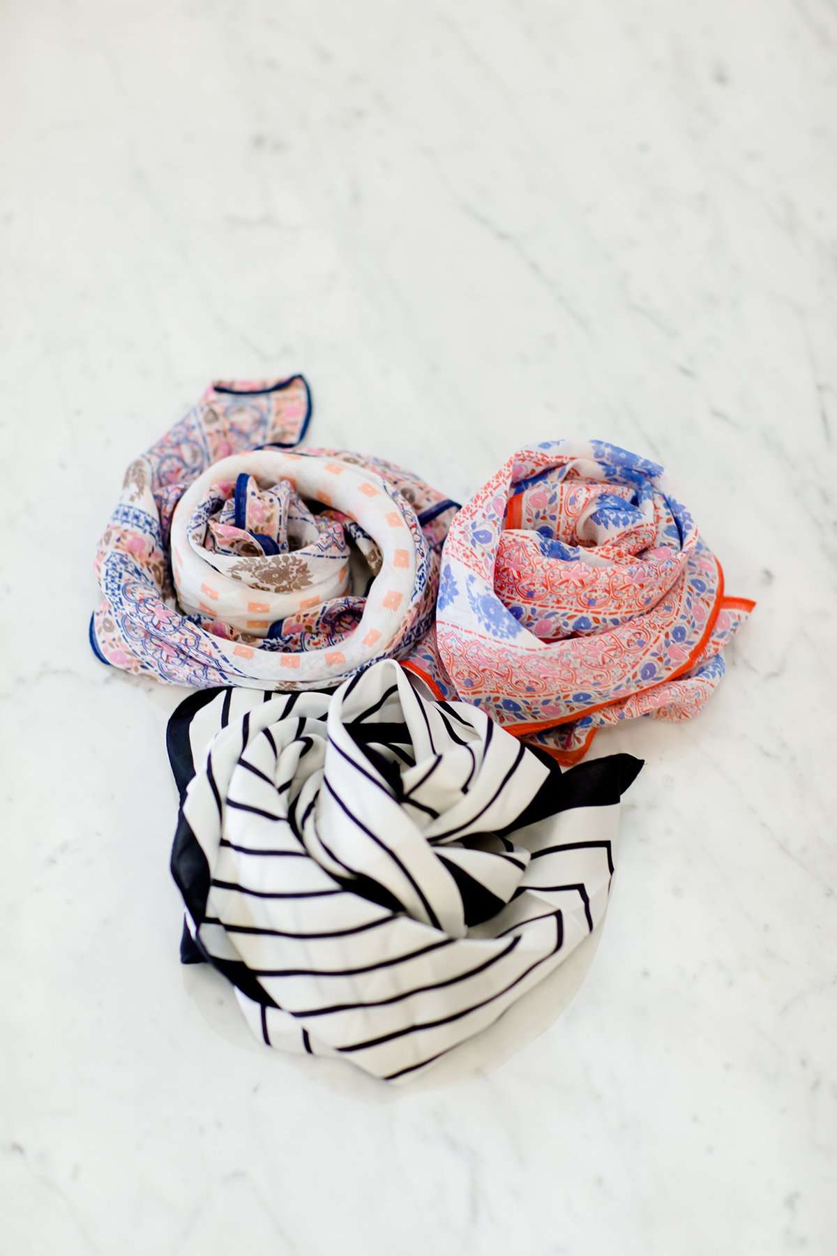 Floral and geometric print, orange and blue bandana scarves