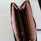 Geomeric Minimalist Wallet with zipper closure and bill divider. Black, white, peach, mauve and mint colors available.