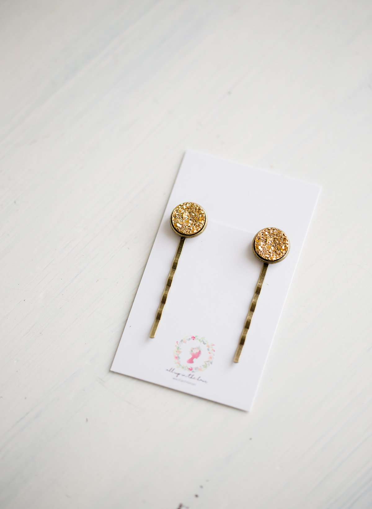 We love these unique, Gold Druzy Bobby Pins! These make a fun addition to your hair for small bursts of fun. You will find these make a great gift too!