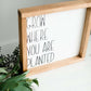 Woodframe Signboard that has script writing that says " Grow where you are planted".