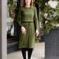 Woman wearing a olive colored hacci midi dress with a elastic waist and paired with black sole society boots