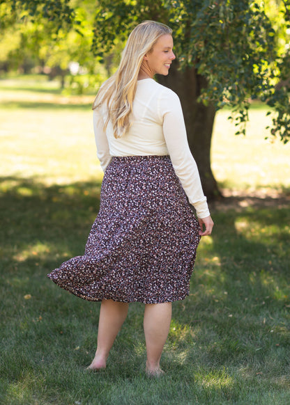 The Harlow Black Floral Midi Skirt is an Inherit Exclusive you'll be able to wear to any occasion. This modest midi skirt was designed to make movement comfortable and effortless all while looking put together and feeling like your best self. This a-line floral skirt has enough room for biking and enough elegance for church. The pink and white florals will look great with just about any top! 