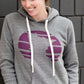 Triblend Minnesota hoodie on a young woman, the hoodie is navy with a gold MN emblem on front and gray with a purple MN emblem on front.