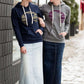 Triblend Minnesota hoodie on a young woman, the hoodie is navy with a gold MN emblem on front and gray with a purple MN emblem on front.