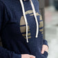 Triblend Minnesota hoodie on a young woman, the hoodie is navy with a gold MN emblem on front and gray with a purple MN emblem on front.