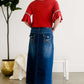 A-line long denim skirt with no slit and a raw edge hem.