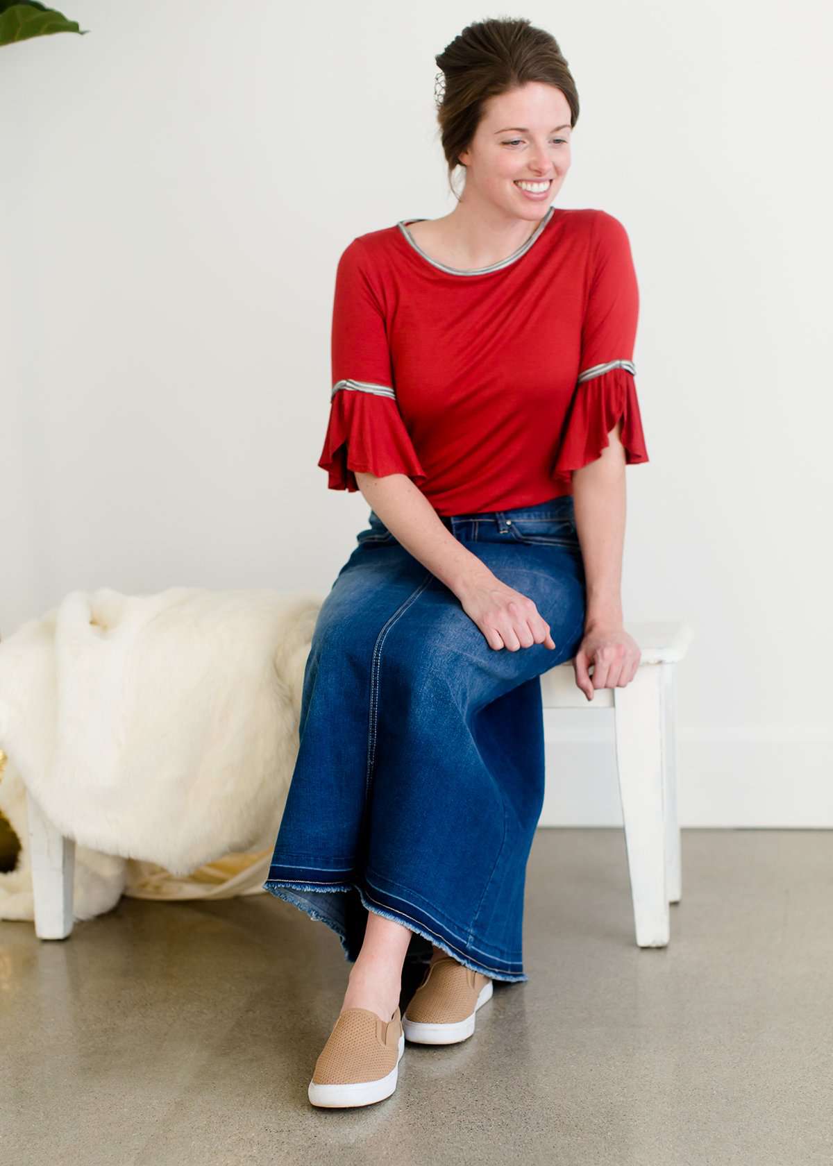 A-line long denim skirt with no slit and a raw edge hem.
