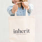 Cream cotton canvas tote with Inherit logo.