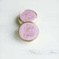Round purple, mary square pill case with three compartments.