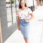 Modest cream tee with multi-colored floral detail 
