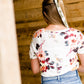 Modest cream tee with multi-colored floral detail 