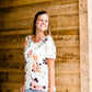 Modest cream tee with multi-colored floral detail 
