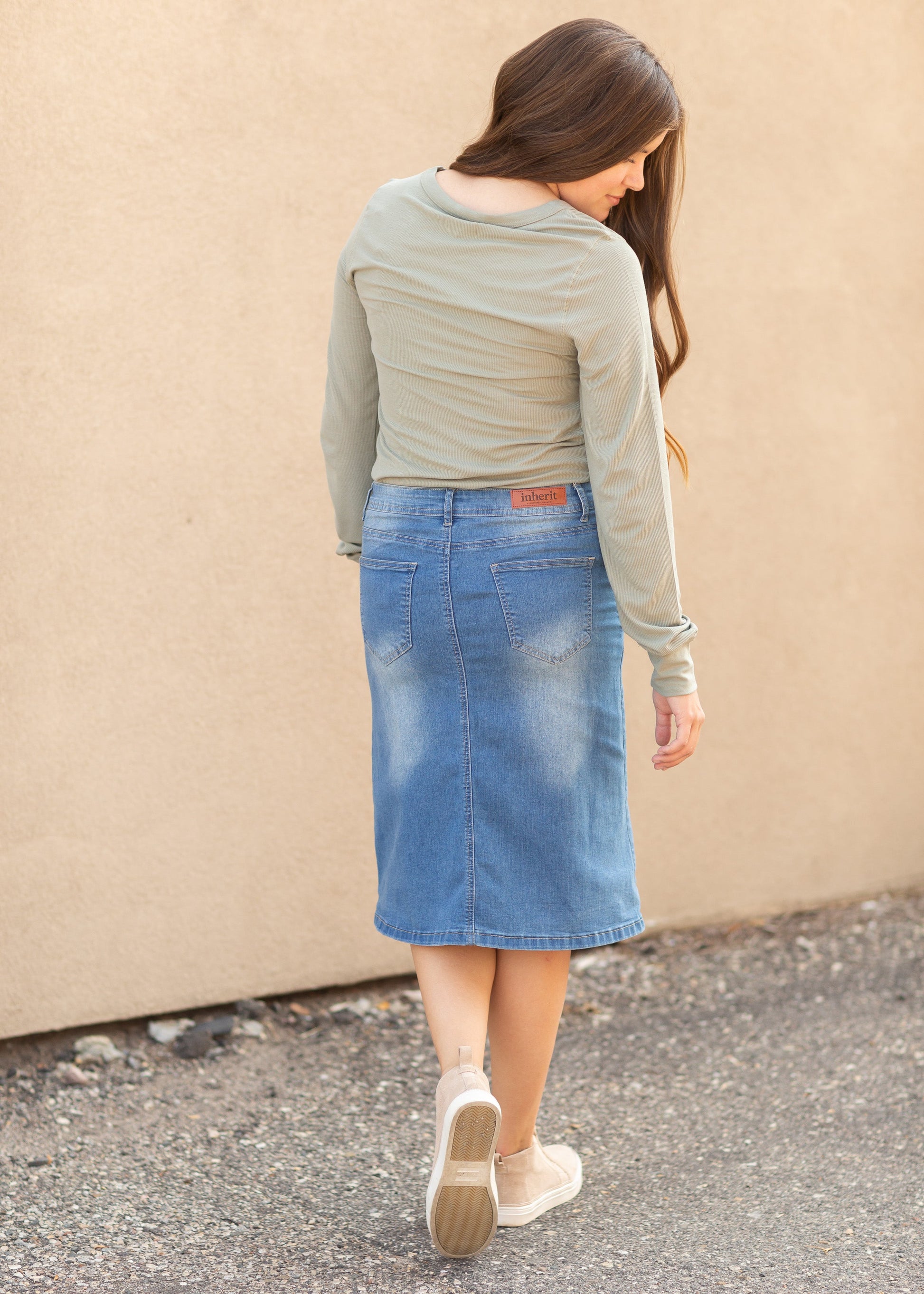 The Josie Vintage Wash Button Front Midi Skirt is a classic you will adore! The Josie is an Inherit Exclusive with a perfect vintage denim wash! You will love the fun button closure detail in the front of this midi skirt!