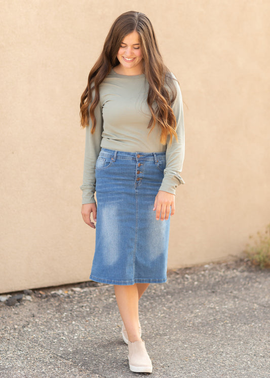The Josie Vintage Wash Button Front Midi Skirt is a classic you will adore! The Josie is an Inherit Exclusive with a perfect vintage denim wash! You will love the fun button closure detail in the front of this midi skirt!