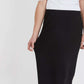 Woman wearing a straight style, ultra soft versatile black midi skirt.