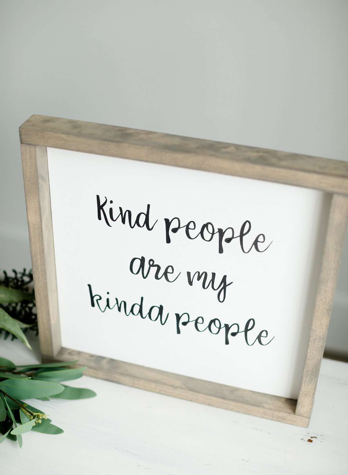 Wood Frame Signboard with the words, " kind people are my kinda people" written in a playful script font.