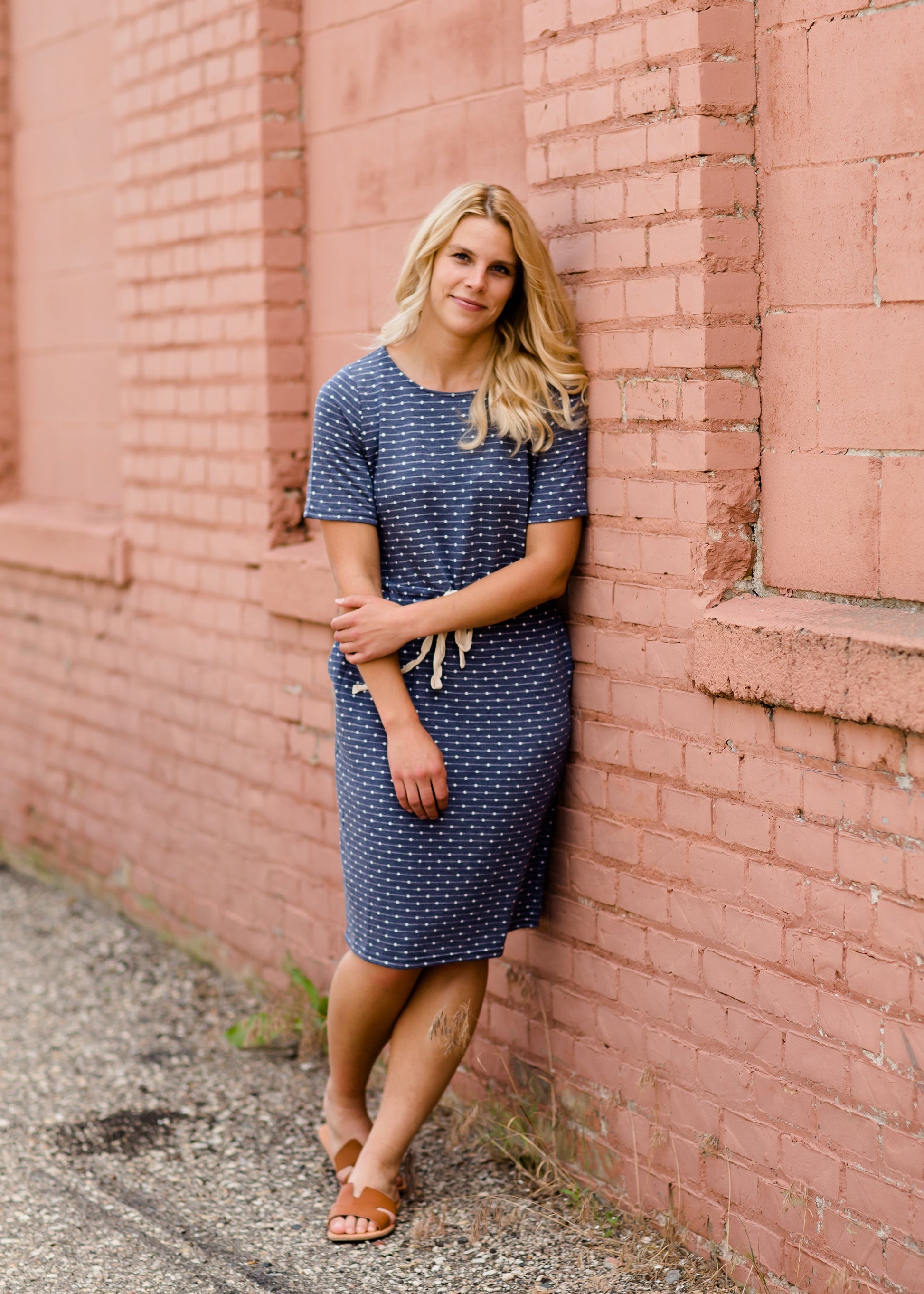 Navy dot knit midi dress with pockets and an adjustable waist