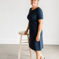 Meet Kristen. This Short sleeve Midi Dress was designed in-house and definitely isn't your typical cotton midi dress! This classic style is crafted with quality fabrics and needs no slip. The elastic waist and longer, short sleeves are extremely flattering and feminine. You will also love the placement of the two front pockets as well, this small patch style pocket hits just right!