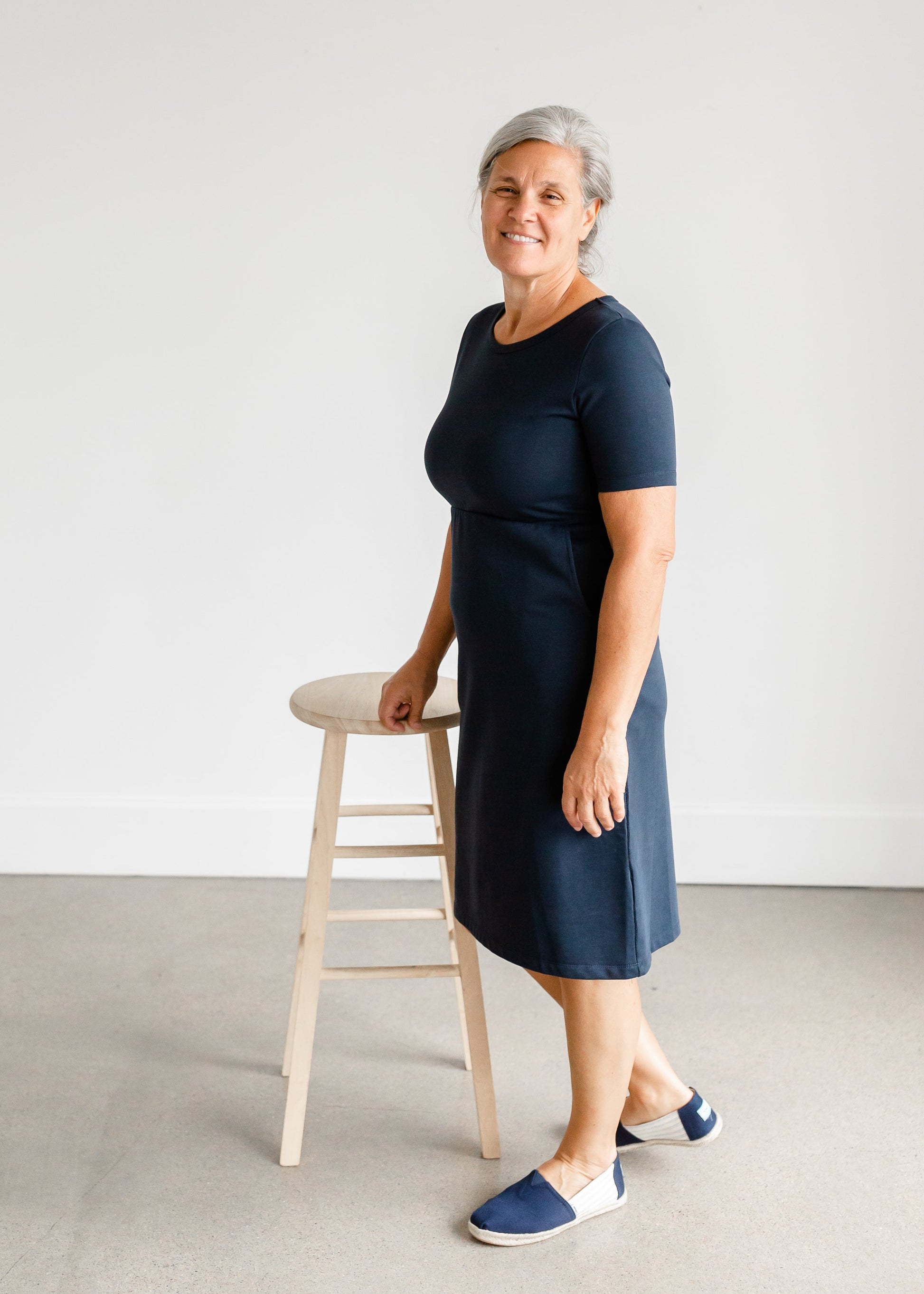 Meet Kristen. This Short sleeve Midi Dress was designed in-house and definitely isn't your typical cotton midi dress! This classic style is crafted with quality fabrics and needs no slip. The elastic waist and longer, short sleeves are extremely flattering and feminine. You will also love the placement of the two front pockets as well, this small patch style pocket hits just right!