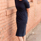 Meet Kristen. This Short sleeve Midi Dress was designed in-house and definitely isn't your typical cotton midi dress! This classic style is crafted with quality fabrics and needs no slip. The elastic waist and longer, short sleeves are extremely flattering and feminine. You will also love the placement of the two front pockets as well, this small patch style pocket hits just right!