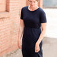 Meet Kristen. This Short sleeve Midi Dress was designed in-house and definitely isn't your typical cotton midi dress! This classic style is crafted with quality fabrics and needs no slip. The elastic waist and longer, short sleeves are extremely flattering and feminine. You will also love the placement of the two front pockets as well, this small patch style pocket hits just right!
