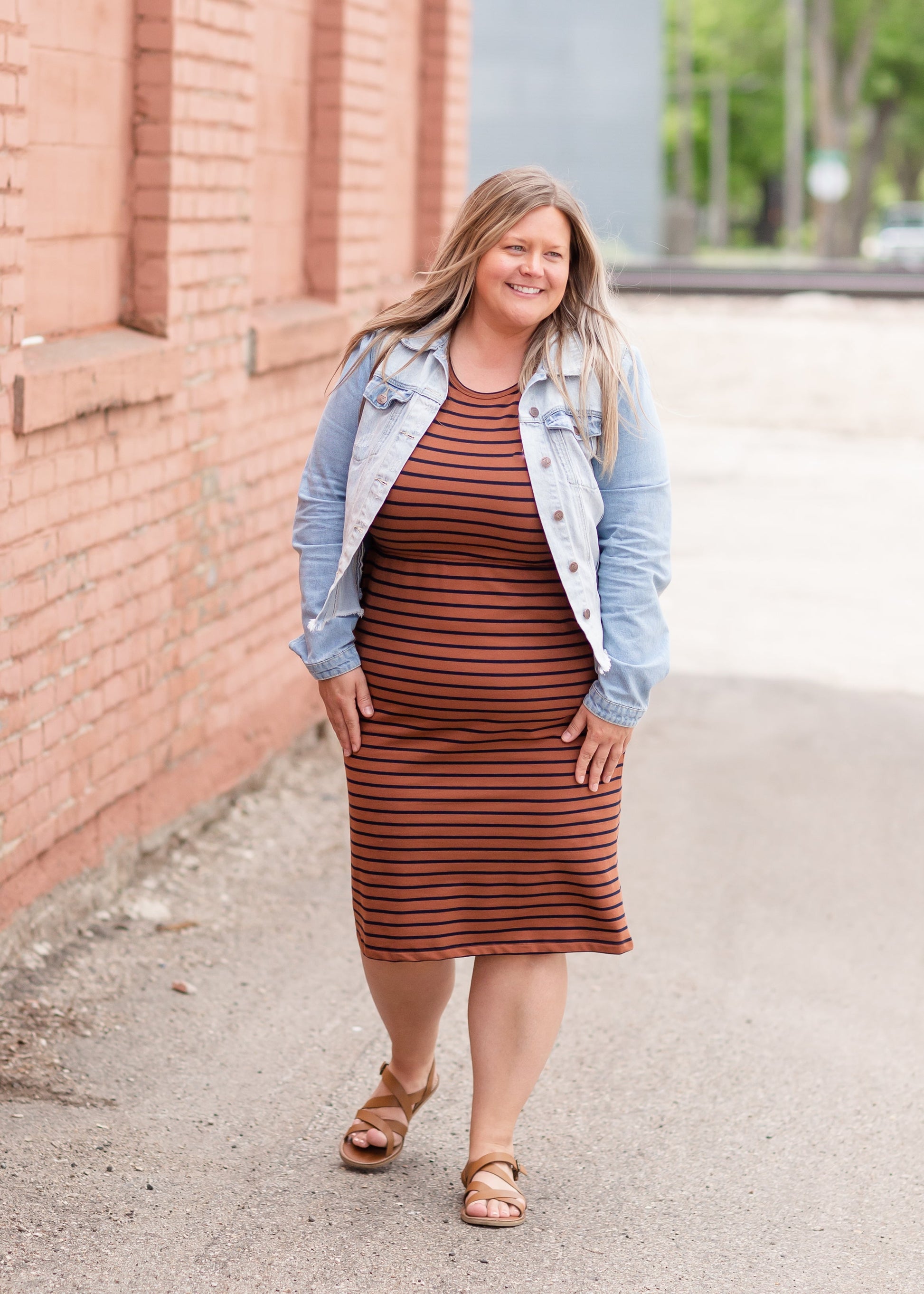 Meet Kristen. This Short sleeve Midi Dress was designed in-house and definitely isn't your typical cotton midi dress! This classic style is crafted with quality fabrics and needs no slip. The elastic waist and longer, short sleeves are extremely flattering and feminine. You will also love the placement of the two front pockets as well, this small patch style pocket hits just right!