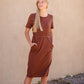 Meet Kristen. This Short sleeve Midi Dress was designed in-house and definitely isn't your typical cotton midi dress! This classic style is crafted with quality fabrics and needs no slip. The elastic waist and longer, short sleeves are extremely flattering and feminine. You will also love the placement of the two front pockets as well, this small patch style pocket hits just right!