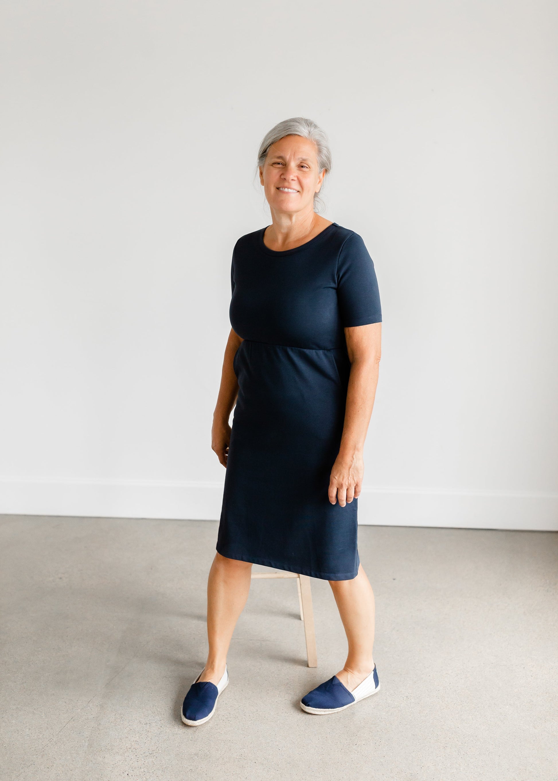 Meet Kristen. This Short sleeve Midi Dress was designed in-house and definitely isn't your typical cotton midi dress! This classic style is crafted with quality fabrics and needs no slip. The elastic waist and longer, short sleeves are extremely flattering and feminine. You will also love the placement of the two front pockets as well, this small patch style pocket hits just right!