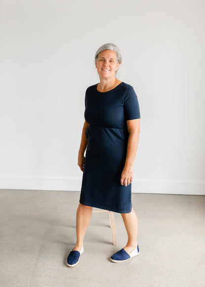 Meet Kristen. This Short sleeve Midi Dress was designed in-house and definitely isn't your typical cotton midi dress! This classic style is crafted with quality fabrics and needs no slip. The elastic waist and longer, short sleeves are extremely flattering and feminine. You will also love the placement of the two front pockets as well, this small patch style pocket hits just right!
