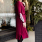 Woman wearing a burgandy and lace midi dress with black tights and sole society back boots. She is standing outside of Inherit Clothing Company.