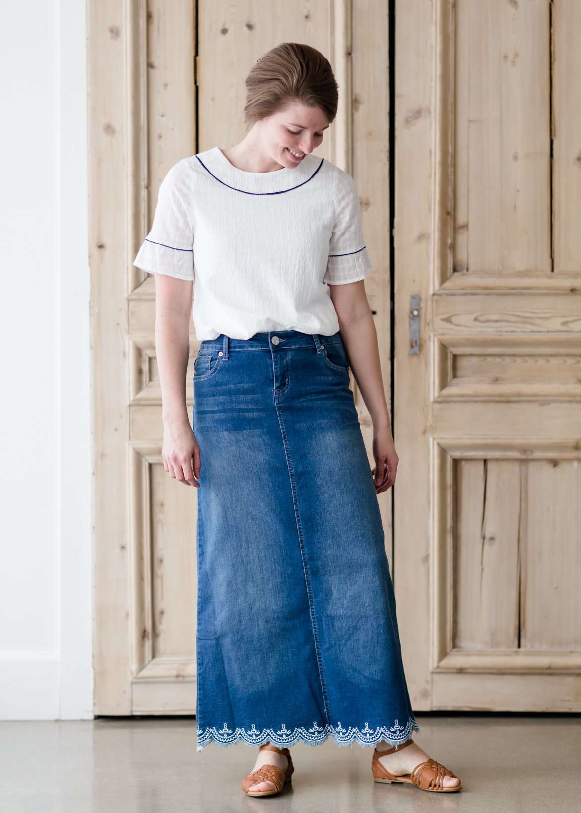 long denim maxi skirt with no slit and a scallop lace hem