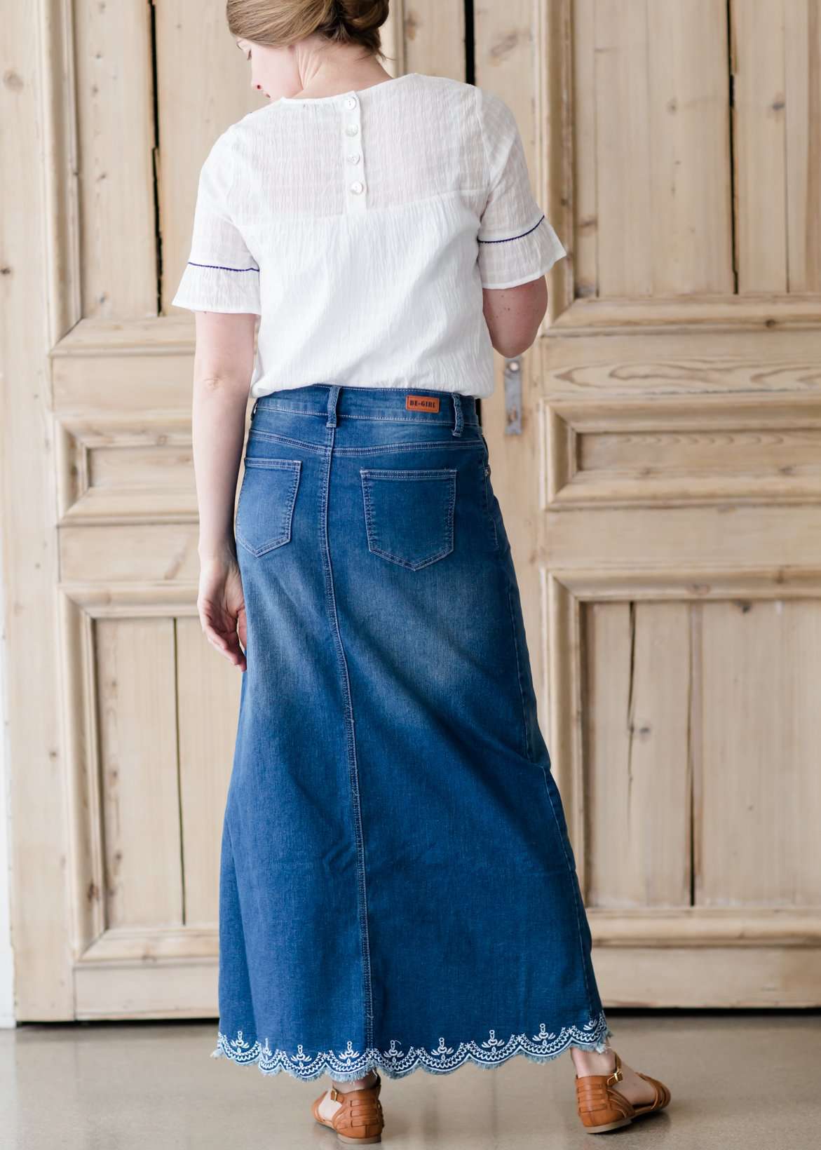 long denim maxi skirt with no slit and a scallop lace hem