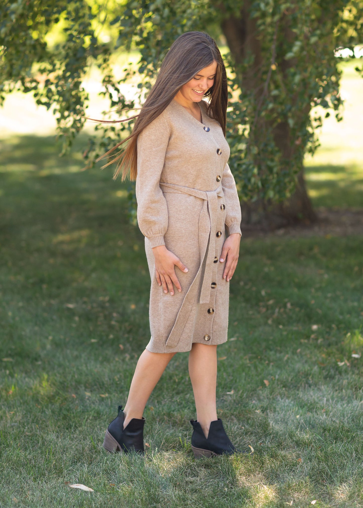 Made with a premium, high quality knit fabric, the Inherit Exclusive Lauren Button up Sweater Dress is a mid-weight dress/cardigan you'll love for the cool weather seasons. If you choose to wear this as a dress, you'll have a modest v-neckline for a flattering look! The tortoise shell buttons cascade down the front and are all functioning which makes this nursing friendly and the detachable belt makes this a versatile option for styling!