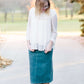 Young woman wearing a vintage inspired ruffle and layered cream colored blouse. This blouse features ruffles and ribbon details.