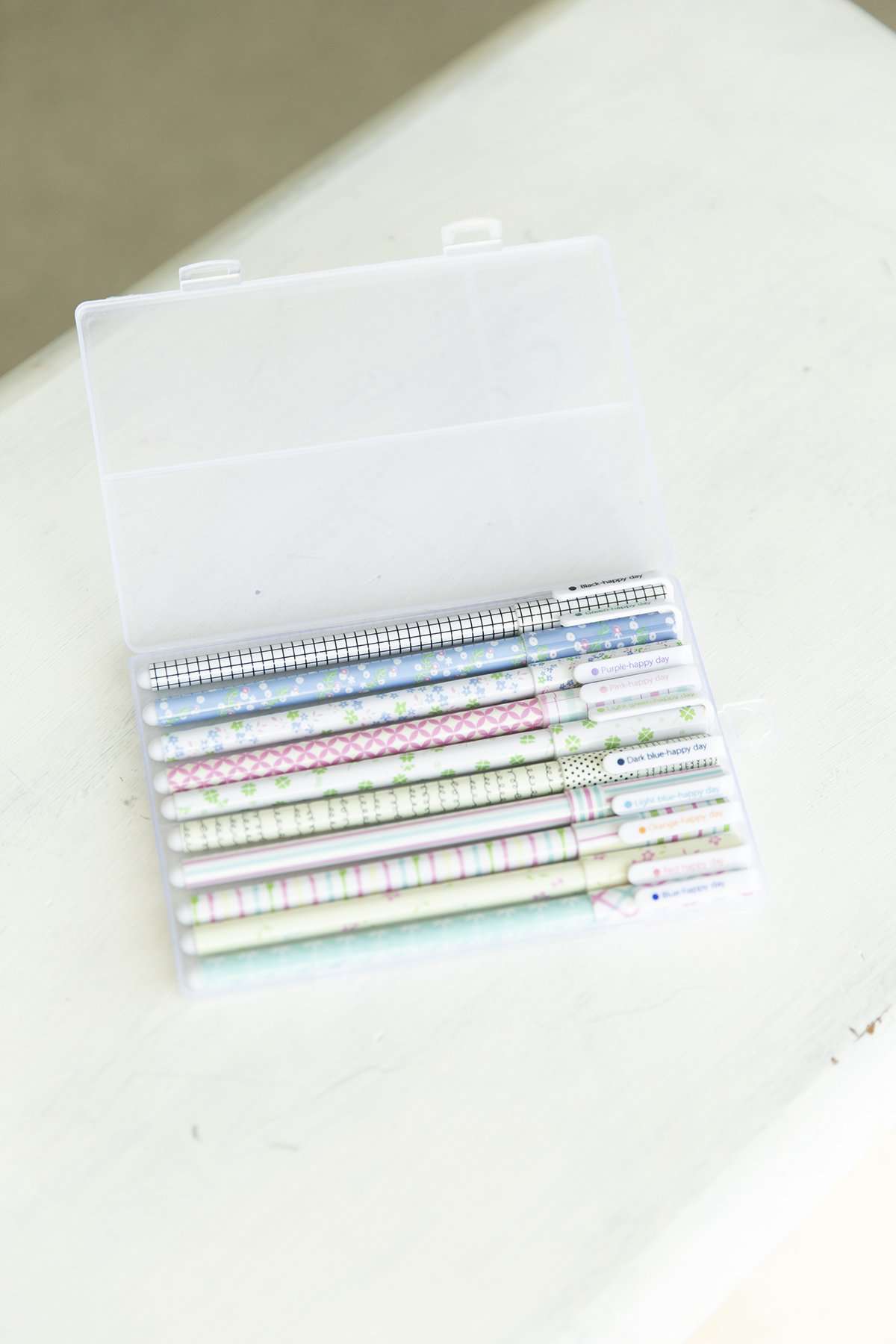 Colorful roller ball point pens in a set of 10 with a carrying case.