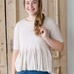 oatmeal colored 3/4 sleeve peplum style top