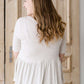 oatmeal colored 3/4 sleeve peplum style top