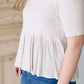 oatmeal colored 3/4 sleeve peplum style top