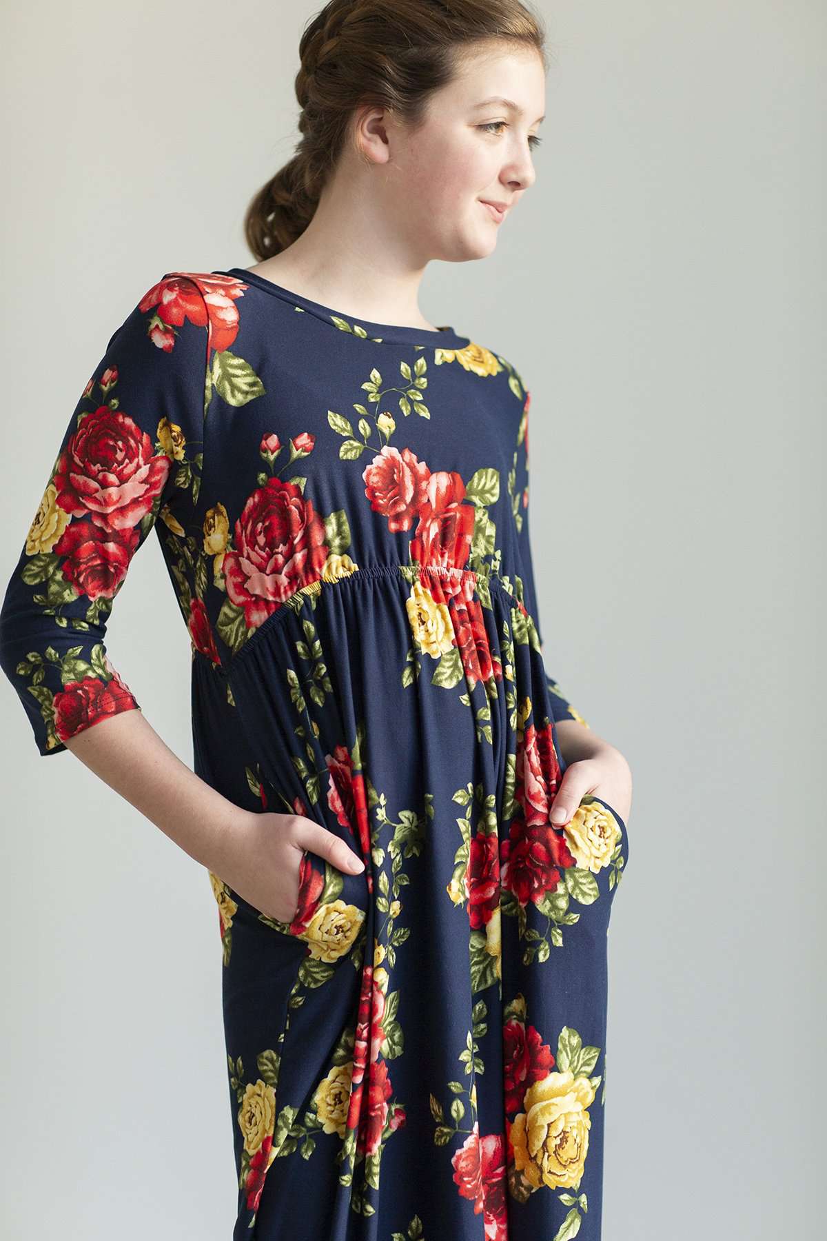 Young girl wearing a navy floral maxi dress