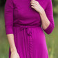 Women's long pink maxi dress that is fully lined, nursing friendly and comes with a belt