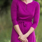 Women's long pink maxi dress that is fully lined, nursing friendly and comes with a belt