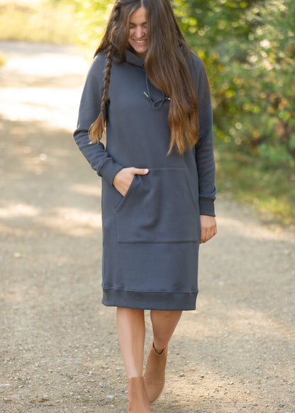 The Marti Sweatshirt Midi Dress is an Inherit Design we made for all your cozy activities! This dress will be great for snuggling up on the couch, heading out during cooler weather or paired with leggings for work! It is super fuzzy on the inside with an elevated, quality fabric on the outside with a kangaroo pocket. There are wide ribbed hems on the bottom and on the cuffs with thumb holes!