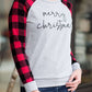 Model woman wearing a grey long sleeve tee with buffalo plaid sleeves and the script font that reads Merry Christmas. 