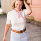 woman wearing a gray mock neck short sleeve top